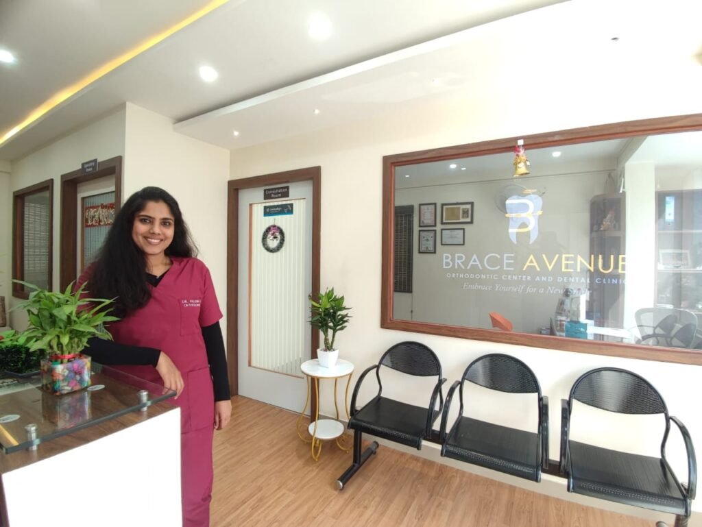 Dr. Anjuna Madakkuni (BDS, MDS – Orthodontics) Standing in the clinic