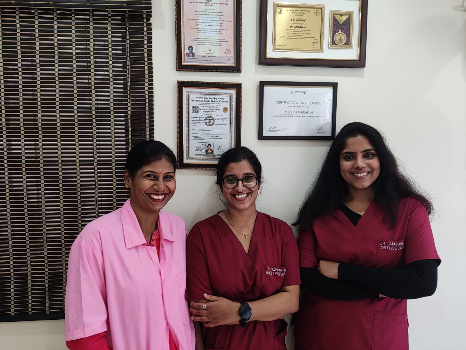 best Dentist Anjuna Madakunni with staffs at dental clinic