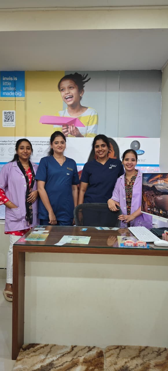 Dr anjuna madakunni and other staffs at dental clinic Bangalore
